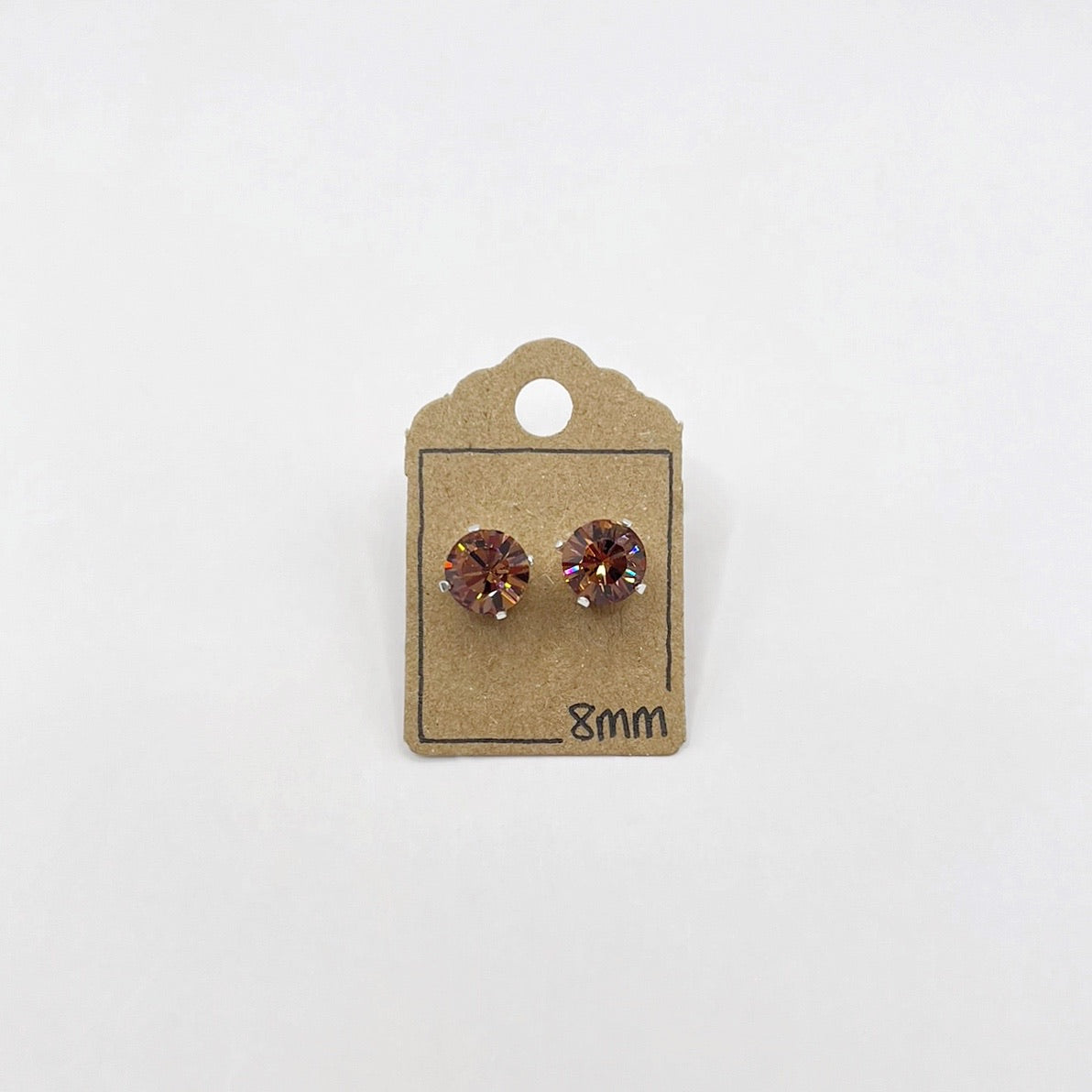 Pair of cut glass stud earrings on a cardboard backing labeled '8mm' against a white background.