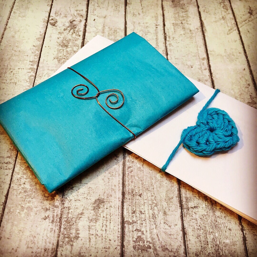 Showing how your order will come tissue wrapped and ready to gift.