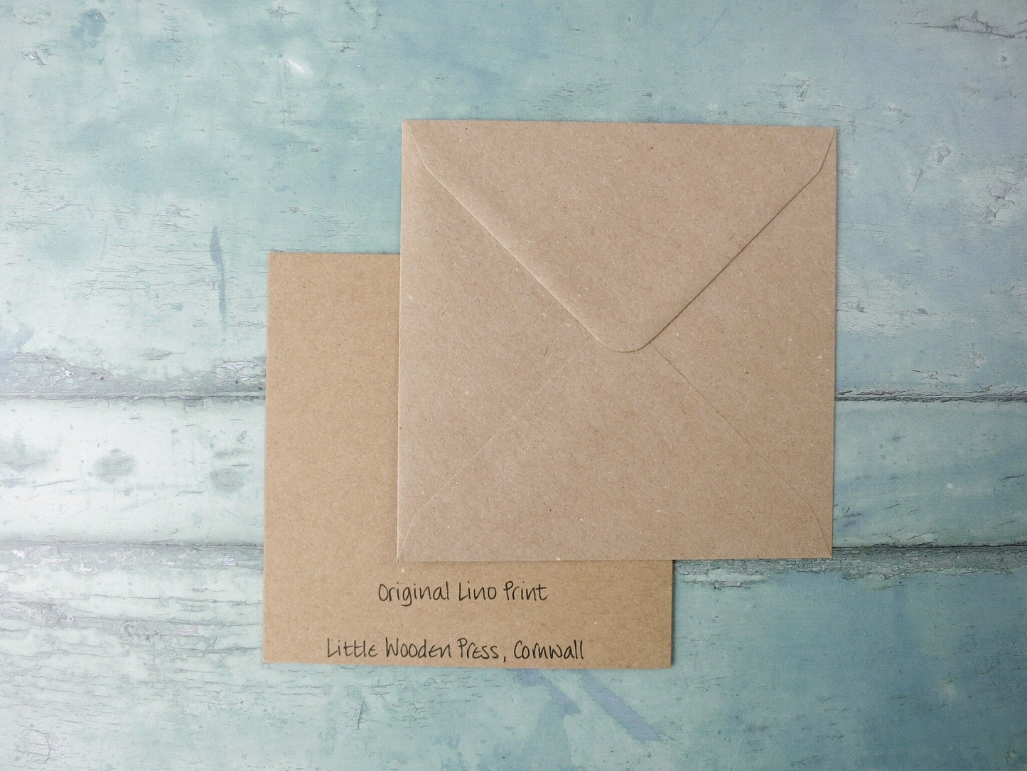 Showing the back of the card with text and matching envelope