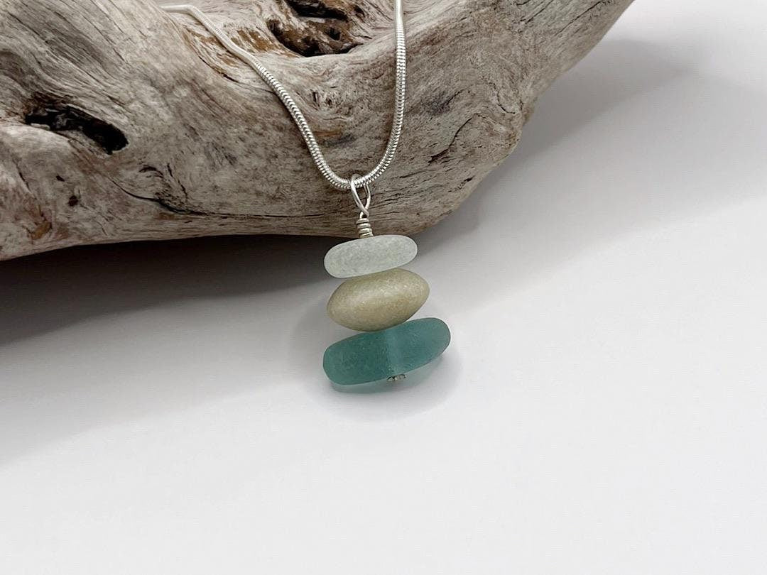 Necklace with stacked sea glass and Jade on a white background