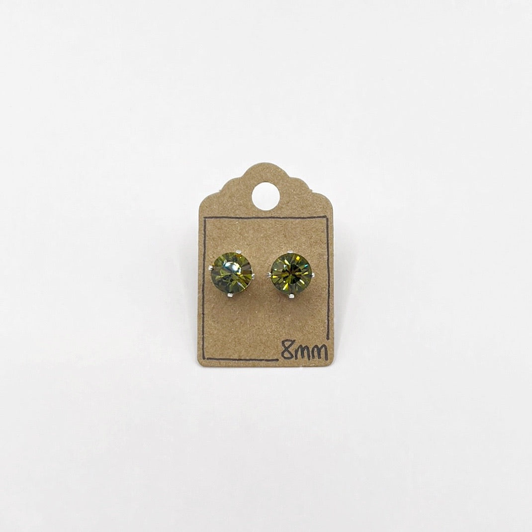 Pair of olive green cut glass stud earrings on a cardboard backing with '8mm' text.