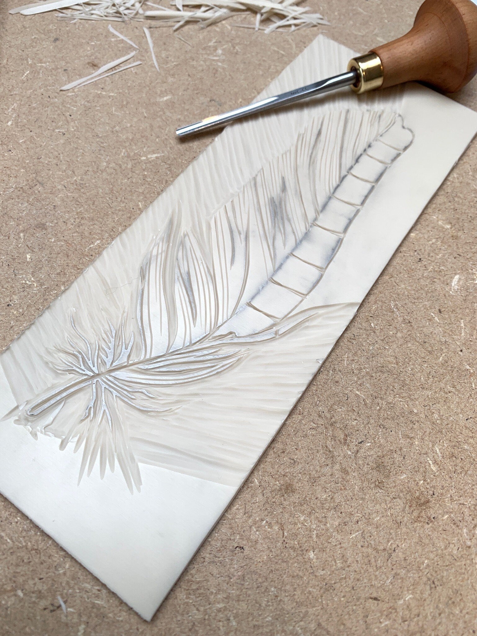 lino and lino cutting tool used to make the Jay feather card
