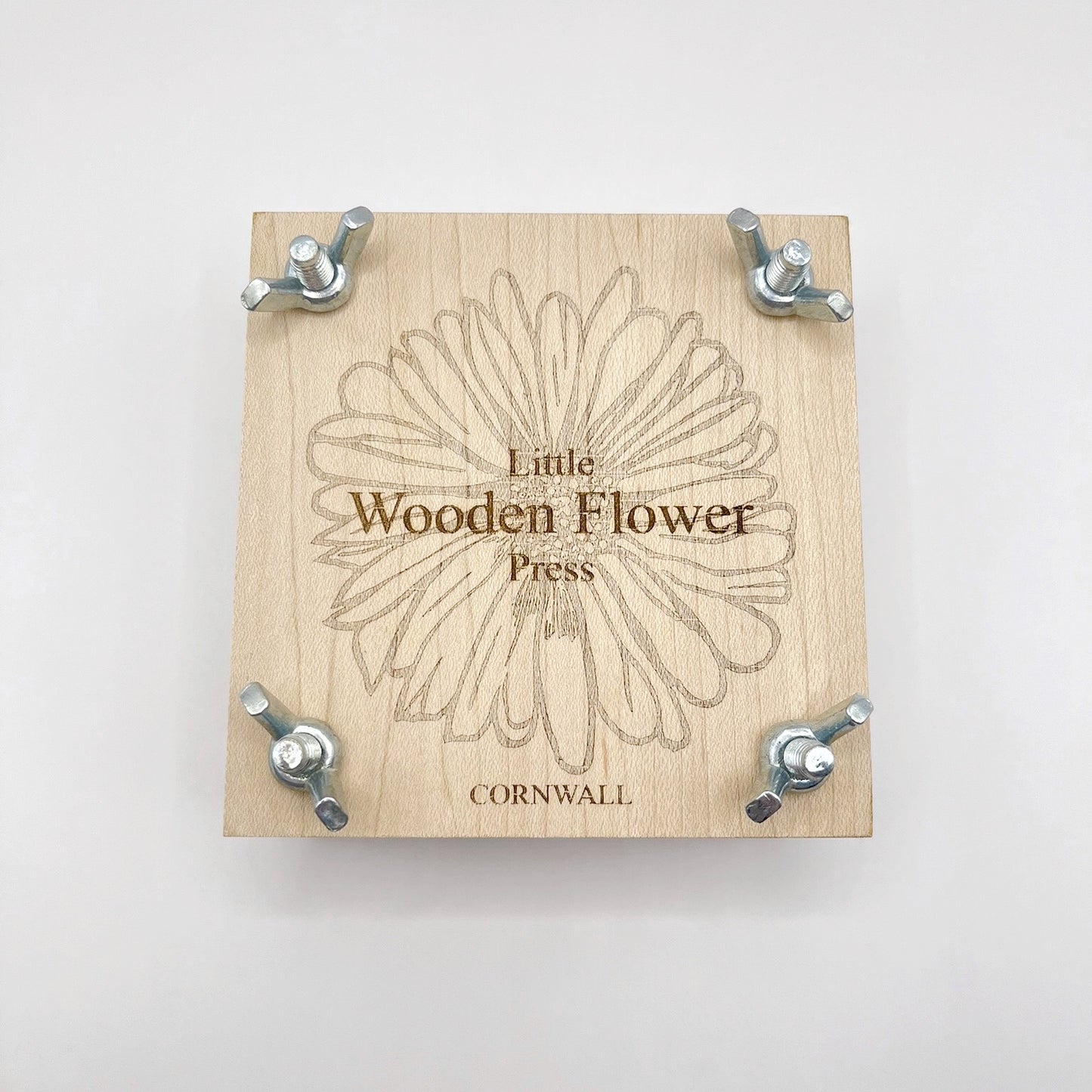 Wooden flower press with 'Little Wooden Flower Press' branding on a white background