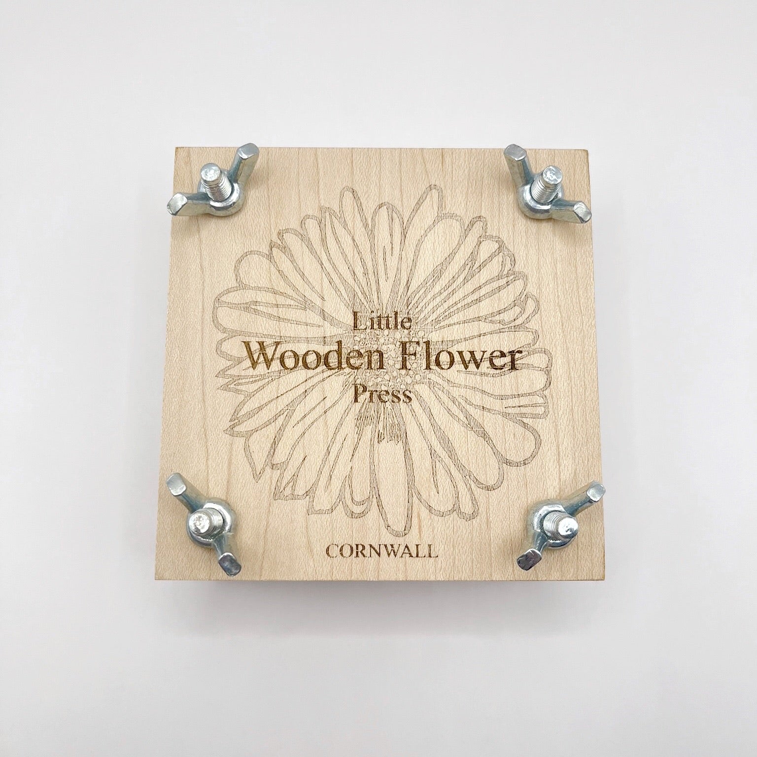 Wooden flower press with 'Little Wooden Flower Press' branding on a white background