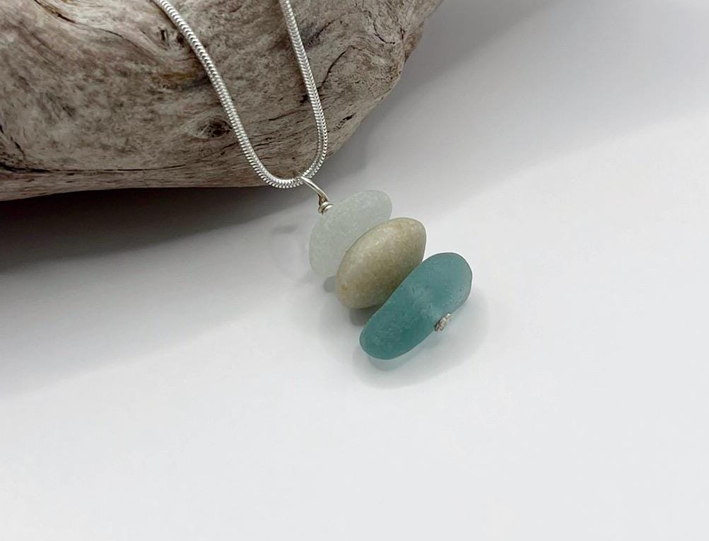 Necklace with sea glass and Jade on a white surface
