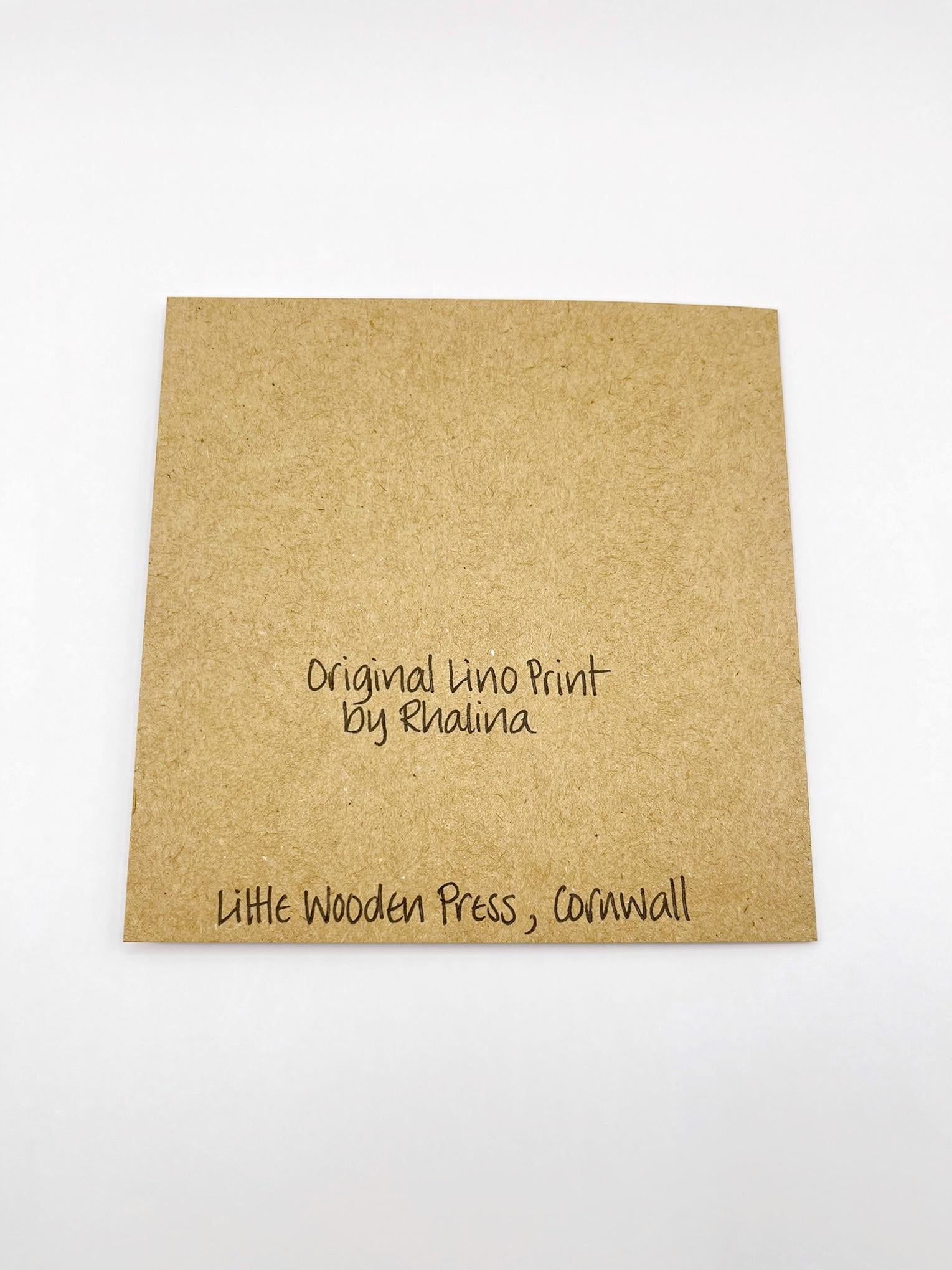Showing the back of the Kraft card with black text, laid on a white background