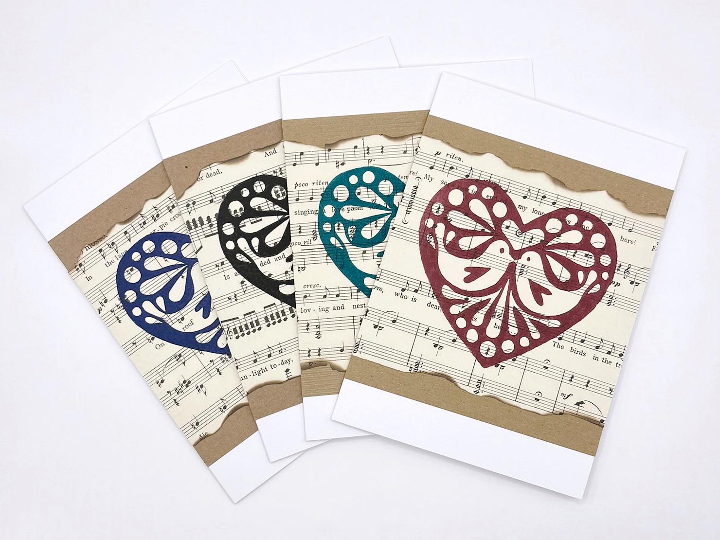 Set of greeting cards with decorative hearts on a sheet music background